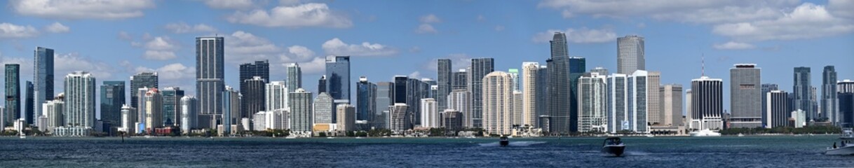 Fototapeta premium Miami's Vibrant City Skyline Along The Waterfront With Modern Skyscrapers And Boats