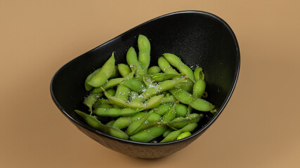 Fermented beans in black bowl