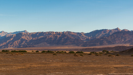 Golden Hour View Near Stovepipe Wells with Rugged Mountains and Rocky Alluvial Foreground, Death Valley