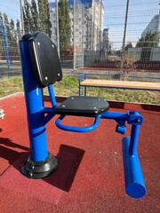 An outdoor fitness and training area with exercise equipment in a modern residential courtyard