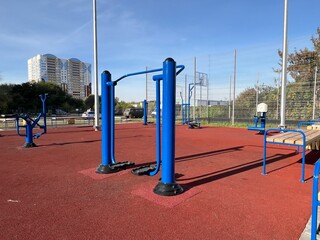 An outdoor fitness and training area with exercise equipment in a modern residential courtyard