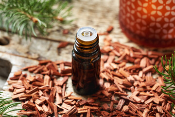 A brown bottle of aromatherapy essential oil with red sandalwood