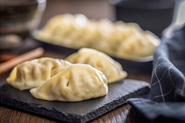 Traditional japanese gyoza dumplings on wooden table.