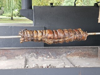 meat roll on a spit, authentic cuisine