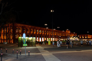 Obraz premium Light illumination in city. Night street with beautiful illuminated building