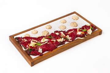 Beef carpaccio platter serving fine dining appetizer