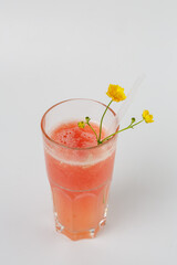Delicious summer pink drink with flower garnish
