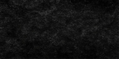 Dark vintage grunge texture of old black paper on a rough wall surface for a blank backdrop design