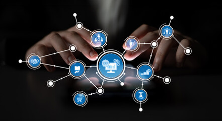 Hands interact with a smartphone displaying various digital icons and data visualizations, embodying the essence of modern business analysis and digital transformation. Crux
