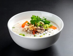 Creamy white rice porridge topped with savory meat, vegetables, and herbs