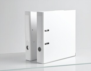 Two white ring binders standing side by side on a glass shelf in a bright office