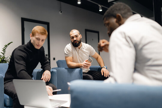 Diverse Team Collaboration in Modern Office Setting for Effective Project Planning