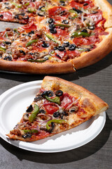 Veggie and pepperoni pizza and slice 