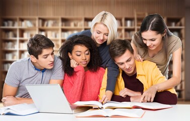 Engaged Group of happy University Students in a Modern Library.