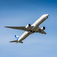 Obraz premium Taking Flight: Modern Airplane Ascending Against Clear Blue Sky for Travel and Aviation Industry