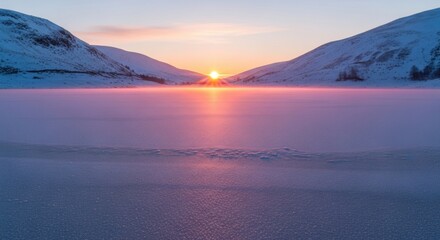 Experience the serene beauty of a winter sunrise over snow-covered mountains and a frozen lake, perfect for travel inspiration and scenic landscape backgrounds