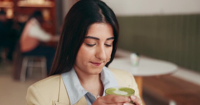 Drinking, matcha and happy woman in cafe for peaceful morning, contemplating or relax on weekend. Reflection, thoughtful and female person in shop with hot beverage for breakfast, wellness and break.