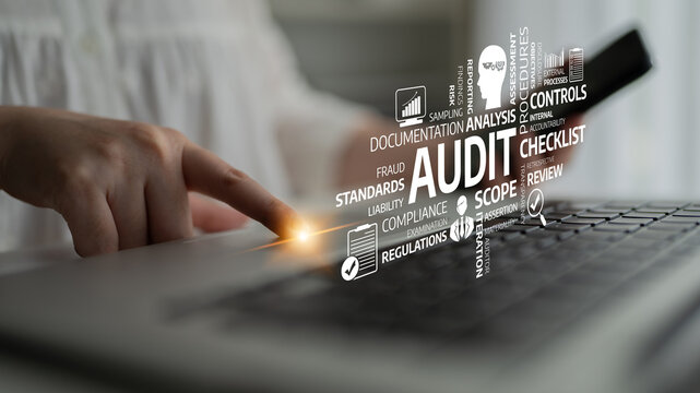 A business professional engages in an audit process using a laptop, showcasing digital tools aligned with compliance and analysis, highlighting key terms in the field. Tessel - Powered by Adobe