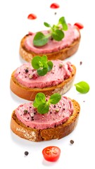 Three slices of toasted bread topped with a pinkish spread, garnished with fresh herbs and pepper