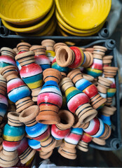Colorful Striped Wooden Knob Vases Piled Together, Hand-Painted Artisanal Decor Ornaments