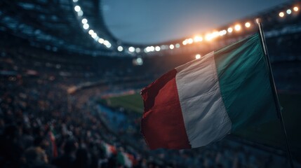 Excitement grows as fans wave the Italian flag during a match at a lively stadium in the evening light