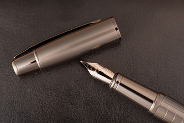 Fountain pen, beautiful fountain pen on rustic stone surface, selective focus.