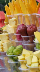 set of summer lemonades in plastic cups for takeaway, colourful Lemonade in transparent cup, Lemonade to go cup with different fruits cocktail. Tropical fruit cups