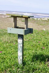 wooden sign on the beach
