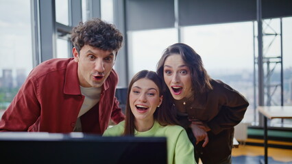 Startupers discussing project online talking to laptop webcam in office closeup