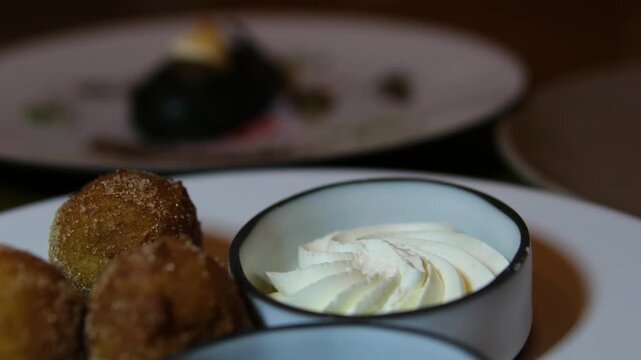 Donuts on industrial conveyer industrial machine, slow motion. High quality 4k footage