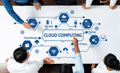 A diverse team collaborates around a table, emphasizing cloud computing concepts such as data security, cloud storage, and backup solutions, enhancing strategic discussions. Amity