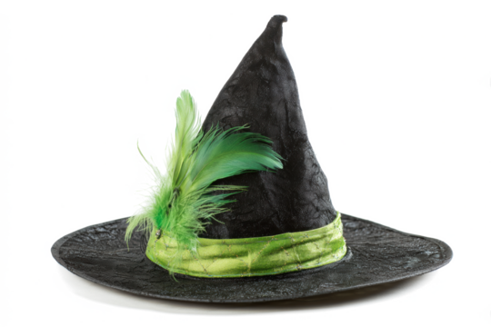 Black witch hat with green feather and ribbon traditional costume accessory for Halloween isolated on white background