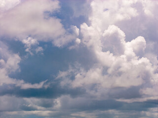 Sky with layers of clouds. Blue sky and puffy clouds background. Cloudscape view full of natural light background. Cloud patterns. Open sky background. Cloudy sky background.