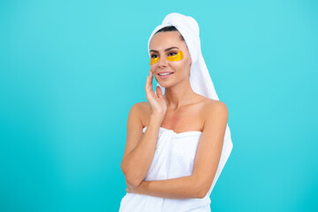 Beauty woman with eye patches. Beautiful woman with moisturizing eyes patches. Facial skin care, cosmetology, golden eyes patches. Young beautiful woman with cosmetic patches on eyes. Facial skin.