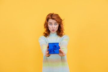 Happy Mothers Day. Gifts and presents for Mothers Day. Happy mother holding gift. Redhead woman receiving gift. surprise. Celebrating Mothers Day or birthday. Womans or Mothers Day concept.