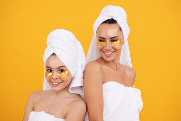 Natural family beauty. Beauty cream for mom and daughter family. Facial skin portrait of mother and daughter. Pamper for skincare. Facial cosmetics family. Family care and beauty.