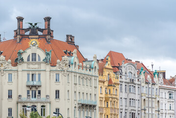 Obraz premium Historic buildings with ornate facades in Prague, Czech Republic