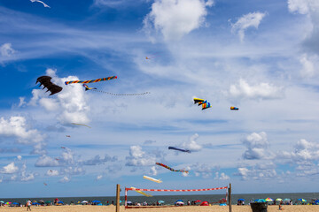 Colorful kites flying in the sky at the Ocean City Boardwalk in Ocean City Maryland USA