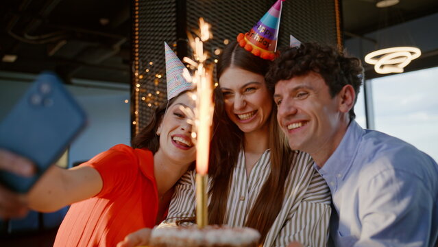 Birthday people making selfie enjoy party in festive hats closeup. Joyful team