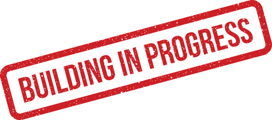 Red rectangular grunge stamp indicating BUILDING IN PROGRESS on construction site plans or documents