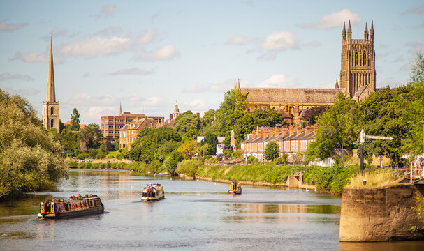 Narrow boats drifting up the River Severn from Diglis Island and locks,at Worcester,England,UK.