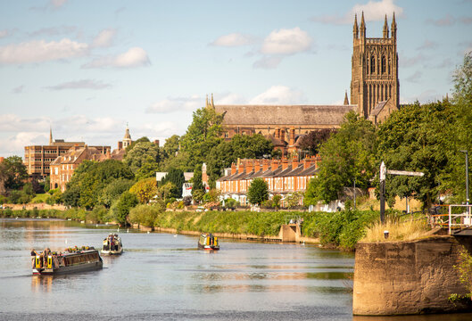 Narrow boats drifting up the River Severn from Diglis Locks,at Worcester,England,UK.