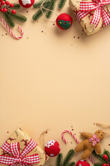 Vertical warm scene with Christmas gifts stockings and ornaments arranged around a beige backdrop;...