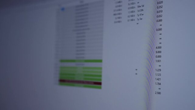 Close-up of computer monitor displaying torrent client interface with various files queuing, sending and error message indicating missing files, representing digital transfer issues and cybersecurity.