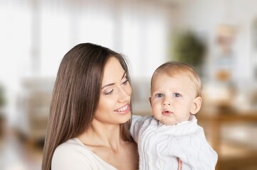 Young beautiful mother hold cute baby
