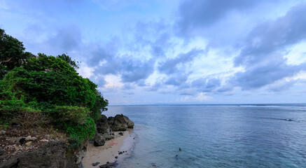 Rocky shoreline with a body of water in the background