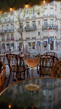 Charming Cafe Scene with Glass and Parisian Architecture
