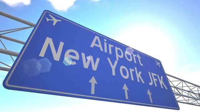 Modern blue travel sign for New York JFK Airport with plane lifting off beyond the sign, departing from New York, United States.