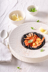 Elegant spaghetti bolognese with fresh seafood and tomatoes.