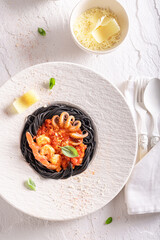 Exclusive spaghetti bolognese with mini octopus and shrimps.
